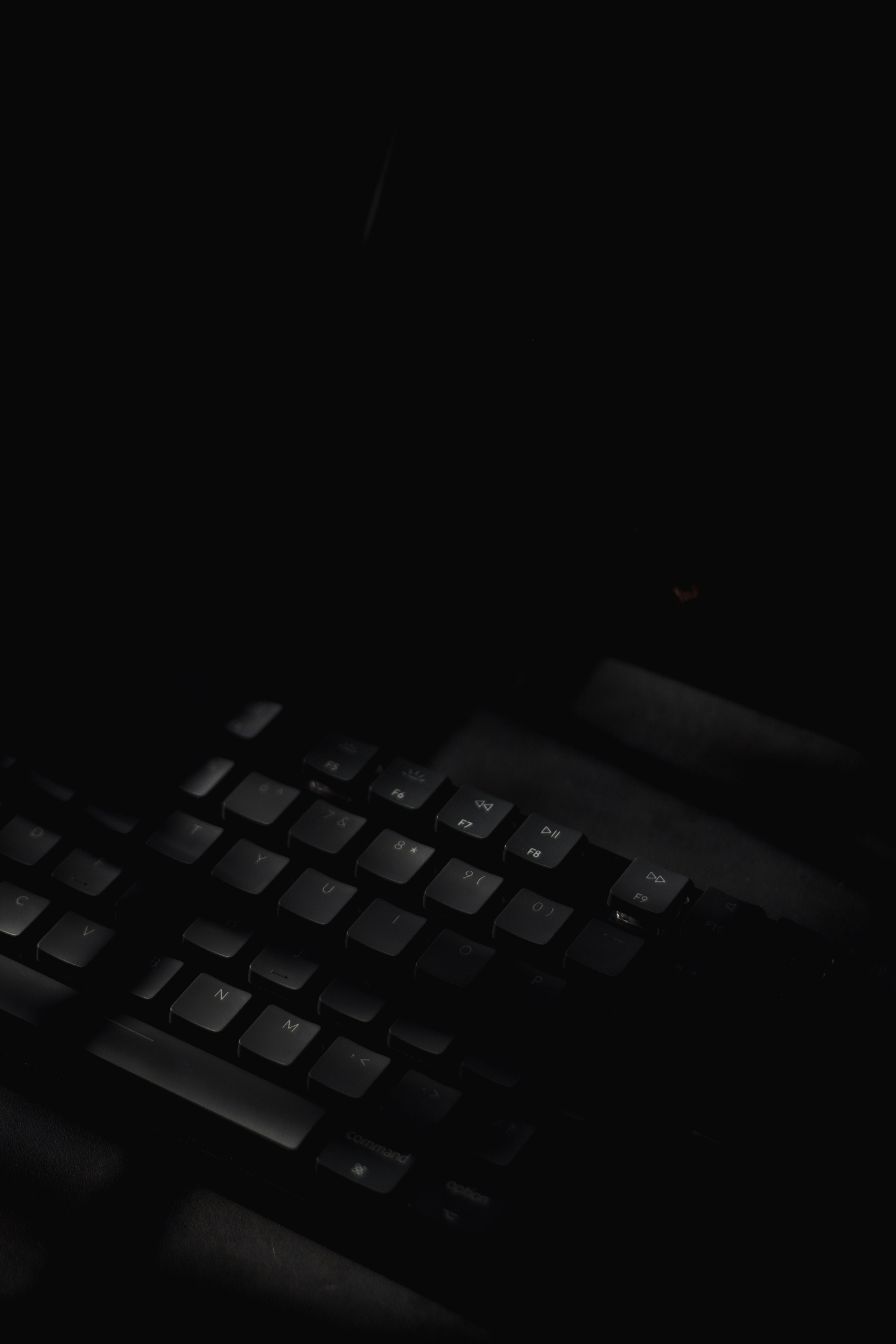 black computer keyboard on black surface